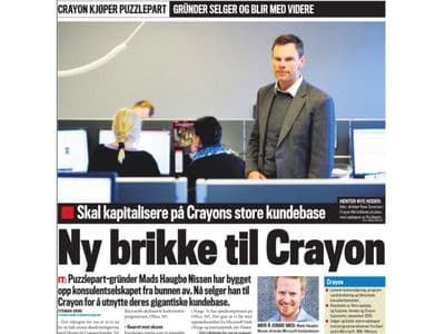 Finansavisen newspaper front page — Crayon acquires Puzzlepart, featuring founder Rune Syversen and Puzzlepart founder Mads Nissen