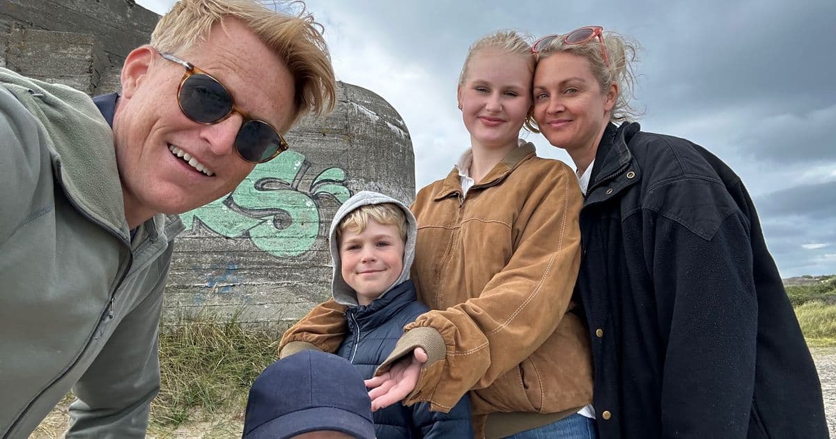 Mads Nissen with wife and three children at a Scandinavian beach near a WWII bunker, casual family outing